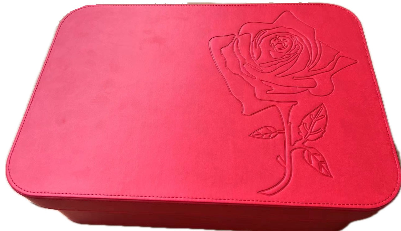 close up of embossed rosee on faux leather train case for carry-on travel and home stackable storage